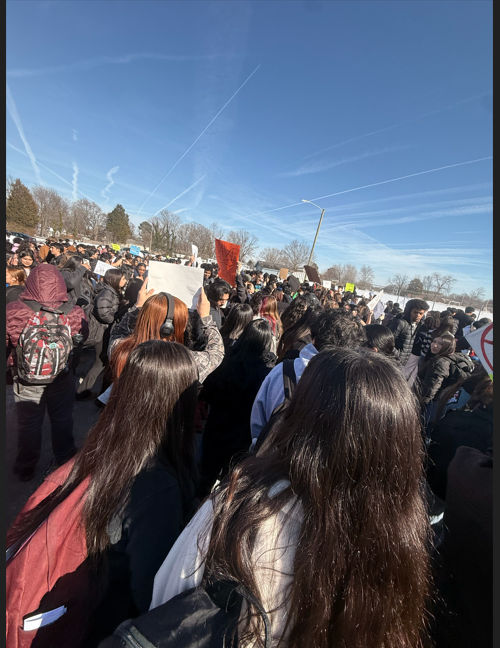 Students gathered in the driver's ed parking lot to protest the behavior of ICE agents nationwide. 
